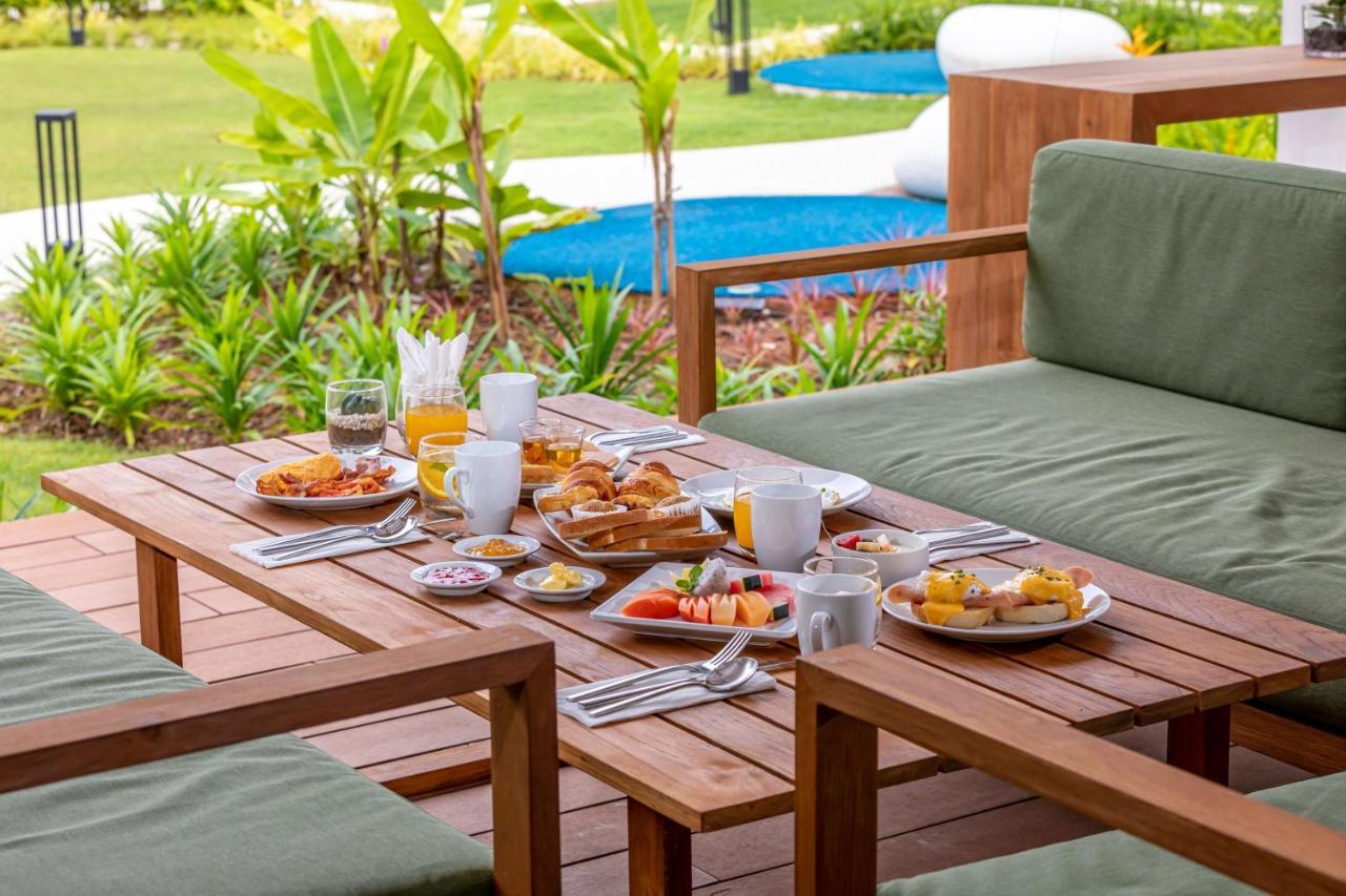 Outrigger Khao Lak Beach Resort - Sha Extra Plus Exterior photo A breakfast table