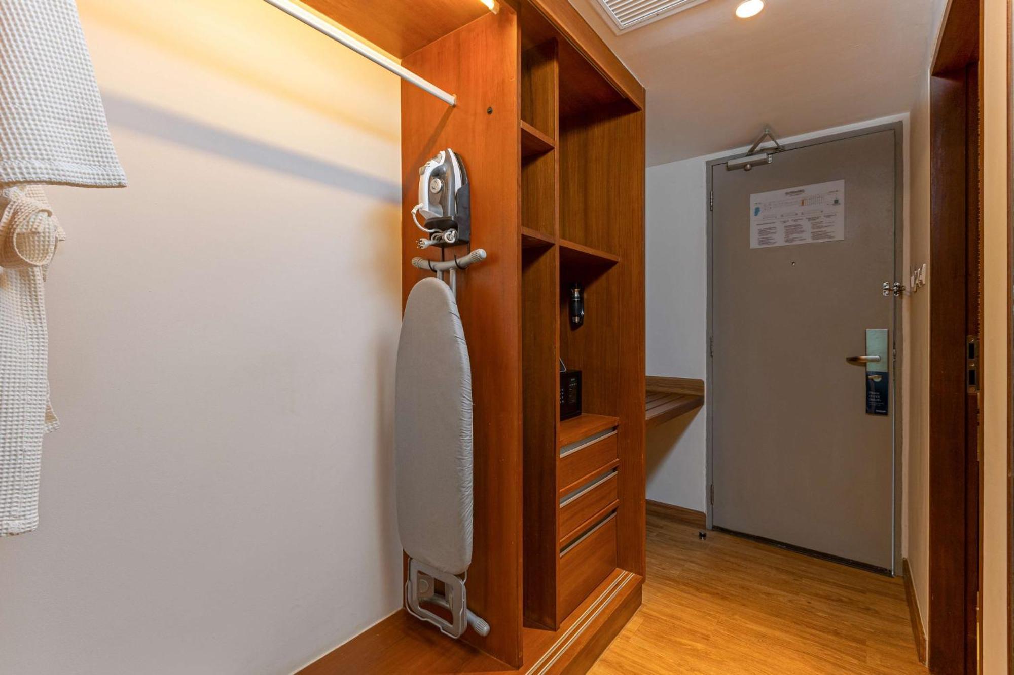 Outrigger Khao Lak Beach Resort - Sha Extra Plus Exterior photo A steam iron and ironing board in a hotel room