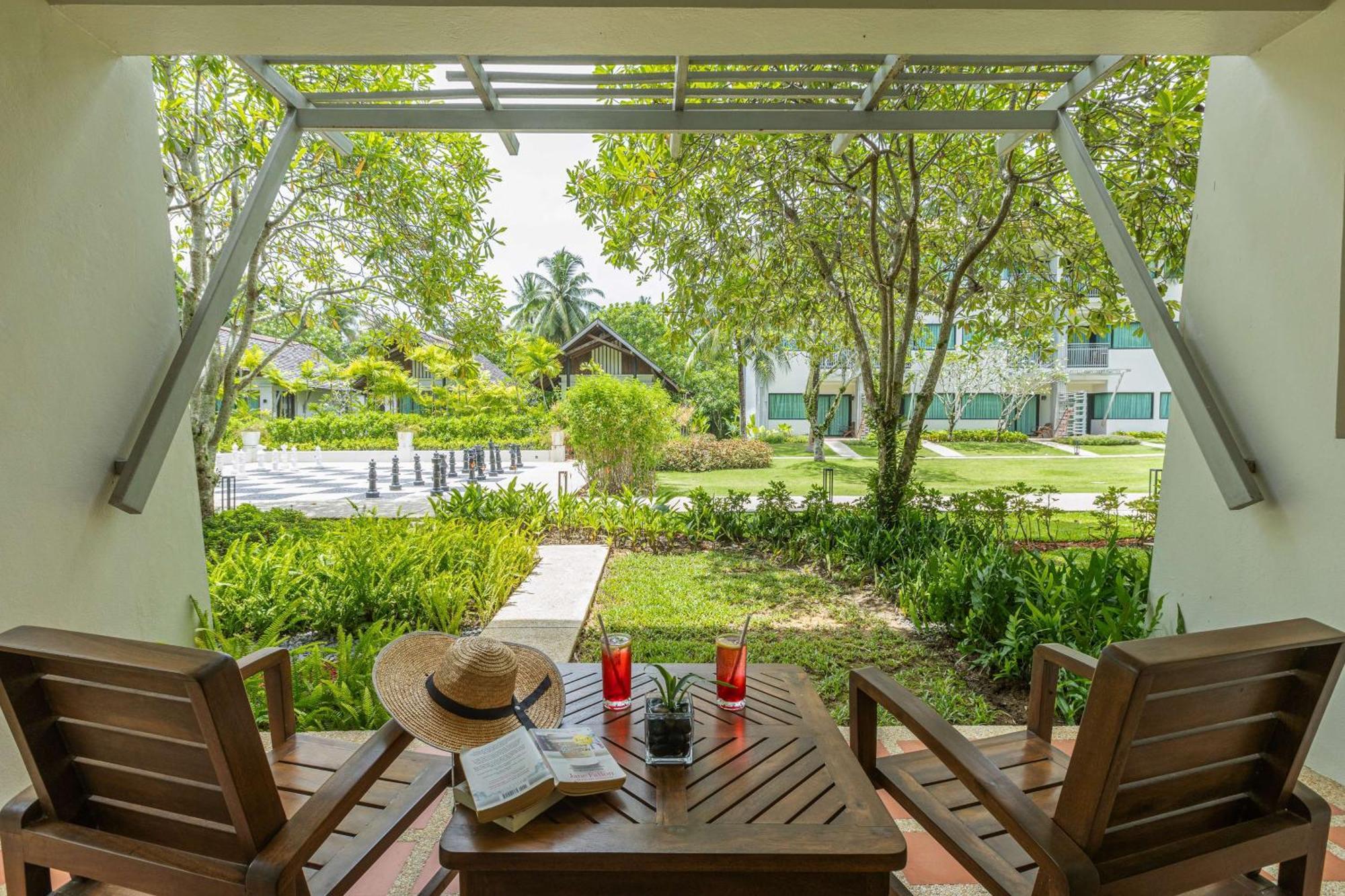 Outrigger Khao Lak Beach Resort - Sha Extra Plus Exterior photo The resort's garden